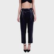 Black leather balloon pants with high waist and voluminous legs worn by a model