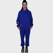  Model wearing Flashmob Nation blue oversized "FM" hoodie and jogger set – casual streetwear