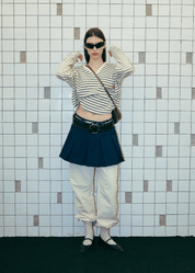 Urban lifestyle look featuring the Clove Pleated Bowling Skirt