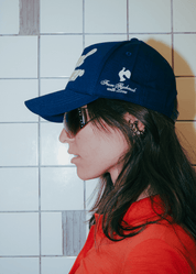 Close-up of the contrast blue underbrim on the navy FM Cruel Summer cap.