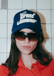 Modern urban streetwear look featuring the FM Cruel Summer cap in navy blue.