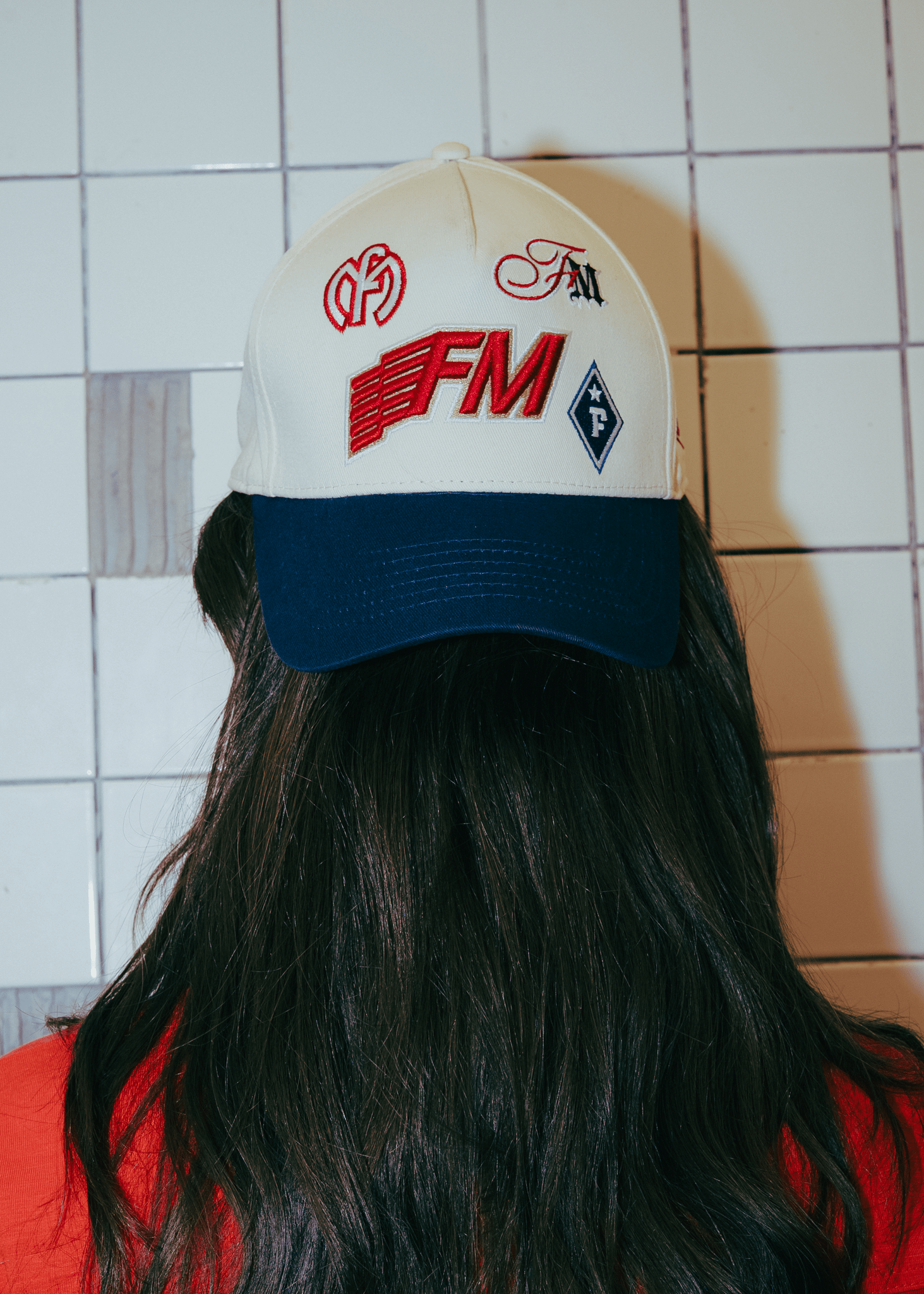 Adjustable snapback closure on the FM Signature beige vintage Emblem Cap.