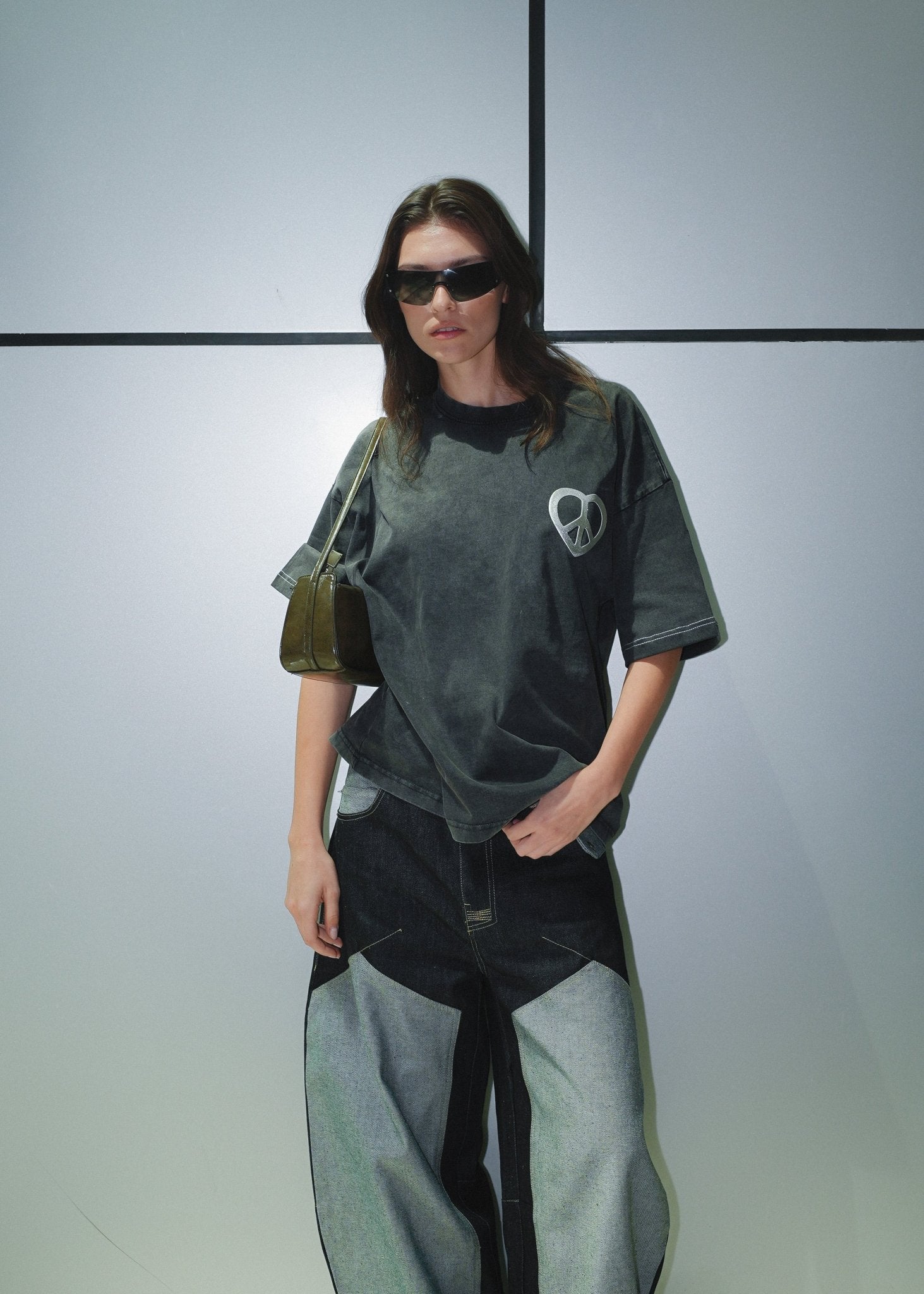 Modern streetwear outfit featuring a Peace & Love Oversized graphic tee.