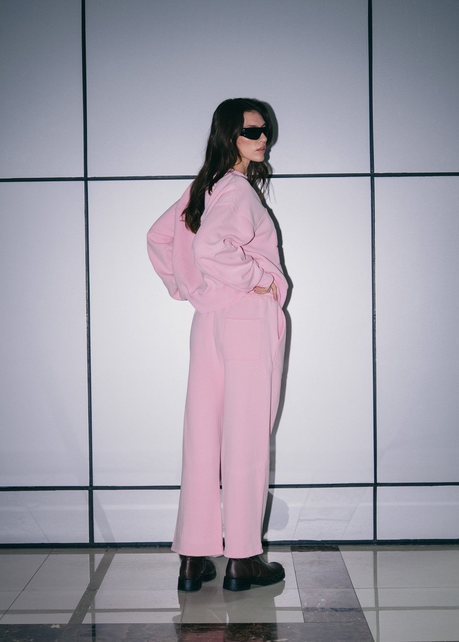 Side profile of the Pink Relaxed Sweatpants highlighting the structured baggy fit.