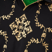 Detailed view of the structured point collar and gold reflective print texture.