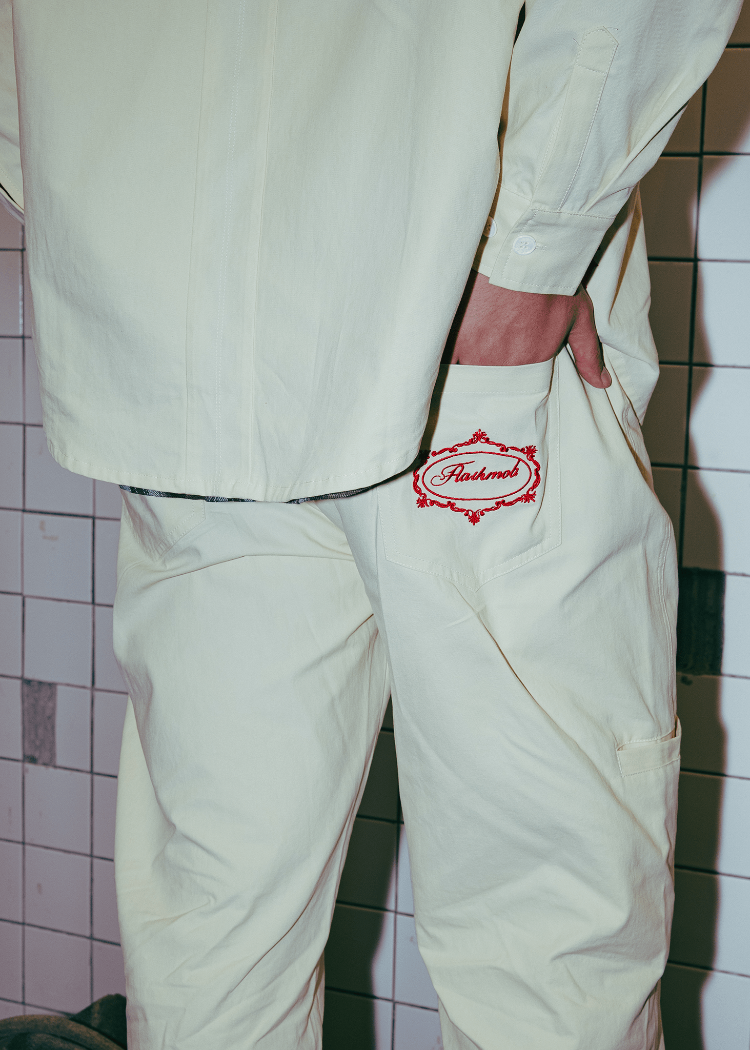 Back profile of White Onyx utility pants showing twisted seam construction