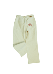 Side profile of White Onyx utility pants showing twisted seam construction