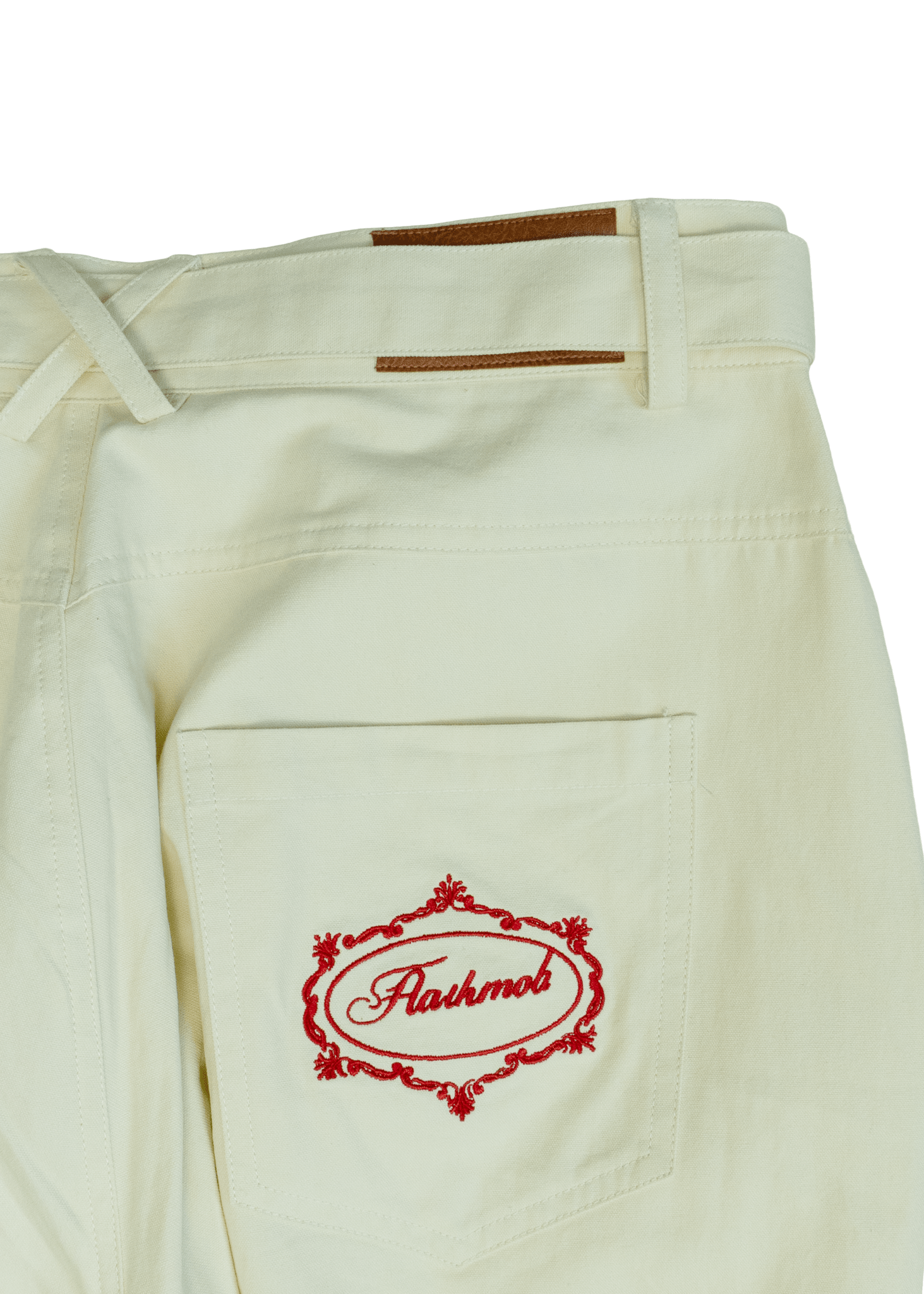 Close-up of sculpted twisted seam architecture on White Onyx trousers