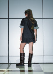 Rear view of the Wesley denim shirt showing the clean industrial panel construction.