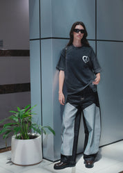 Urban streetwear outfit featuring sculptural rounded denim jeans and a boxy top.